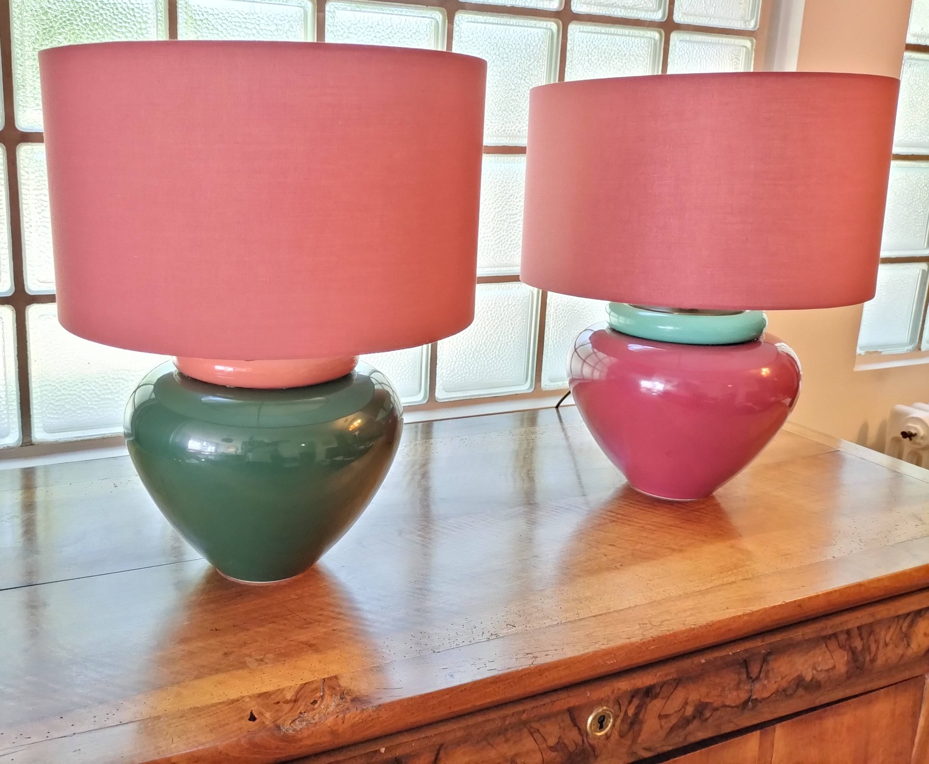 Inverted "mirror" pair of large red and green ceramic lamps.