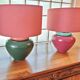 Inverted "mirror" pair of large red and green ceramic lamps.