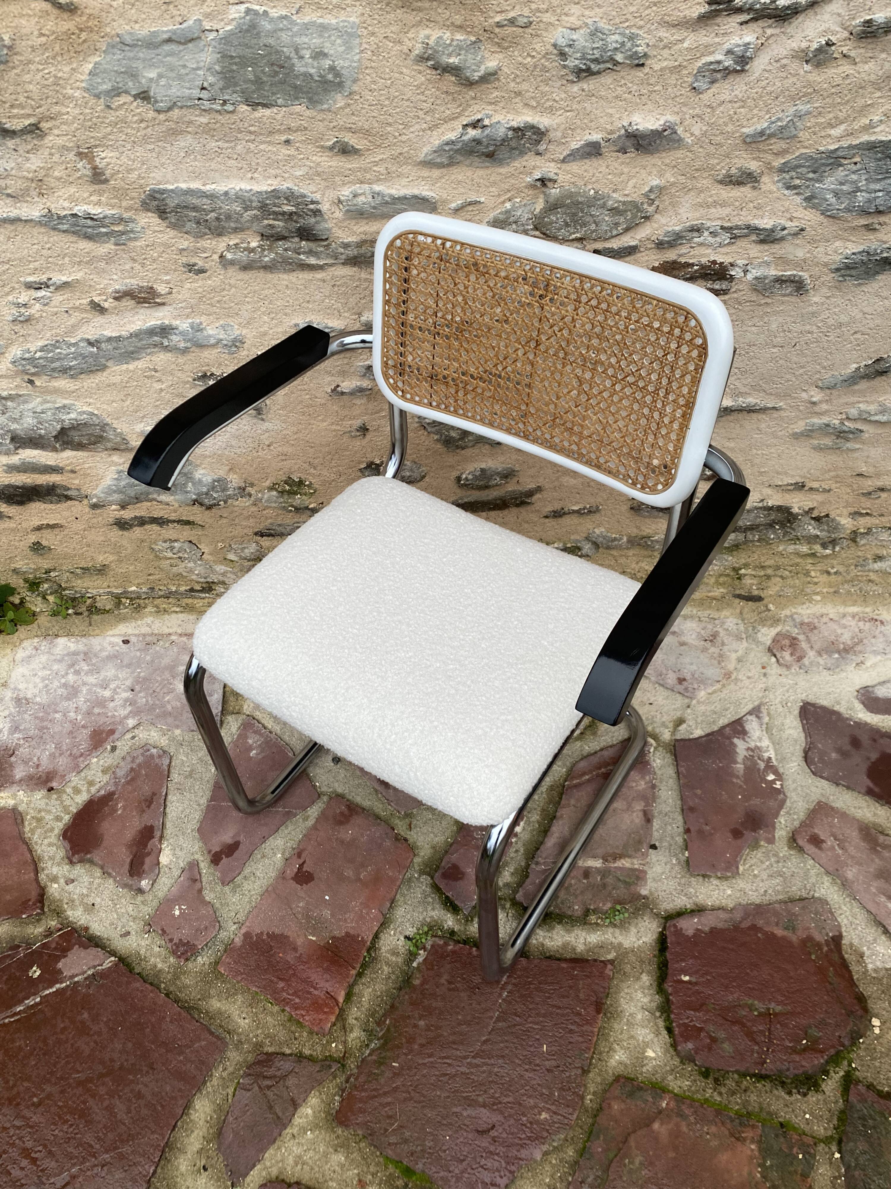 Cantilever armchair in cane and bouclette fabric