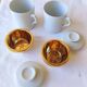 2 white and gold Limoges porcelain tea cups