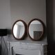 Paire de miroirs anciens ovales