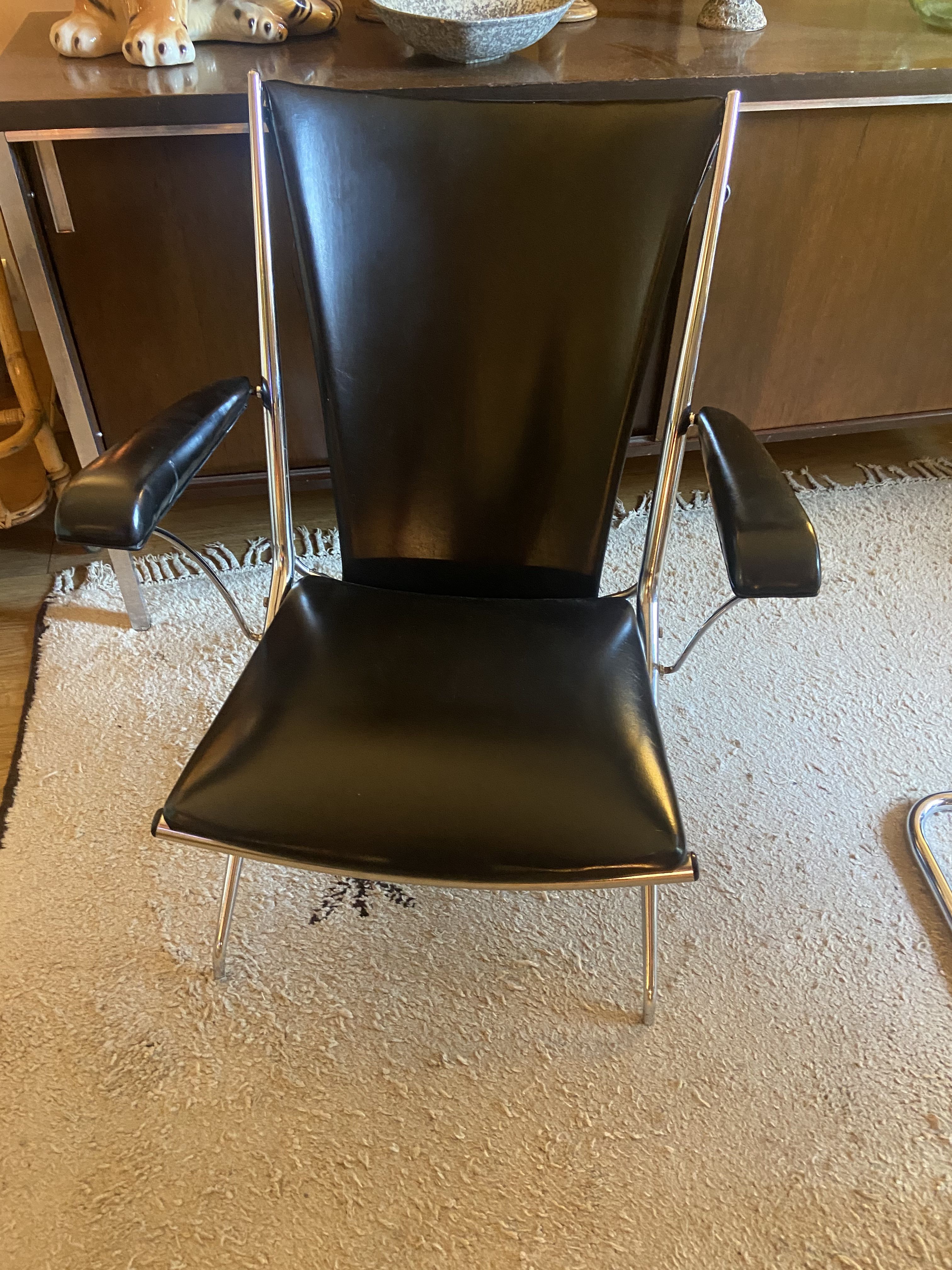 Metal armchair and black skaï
