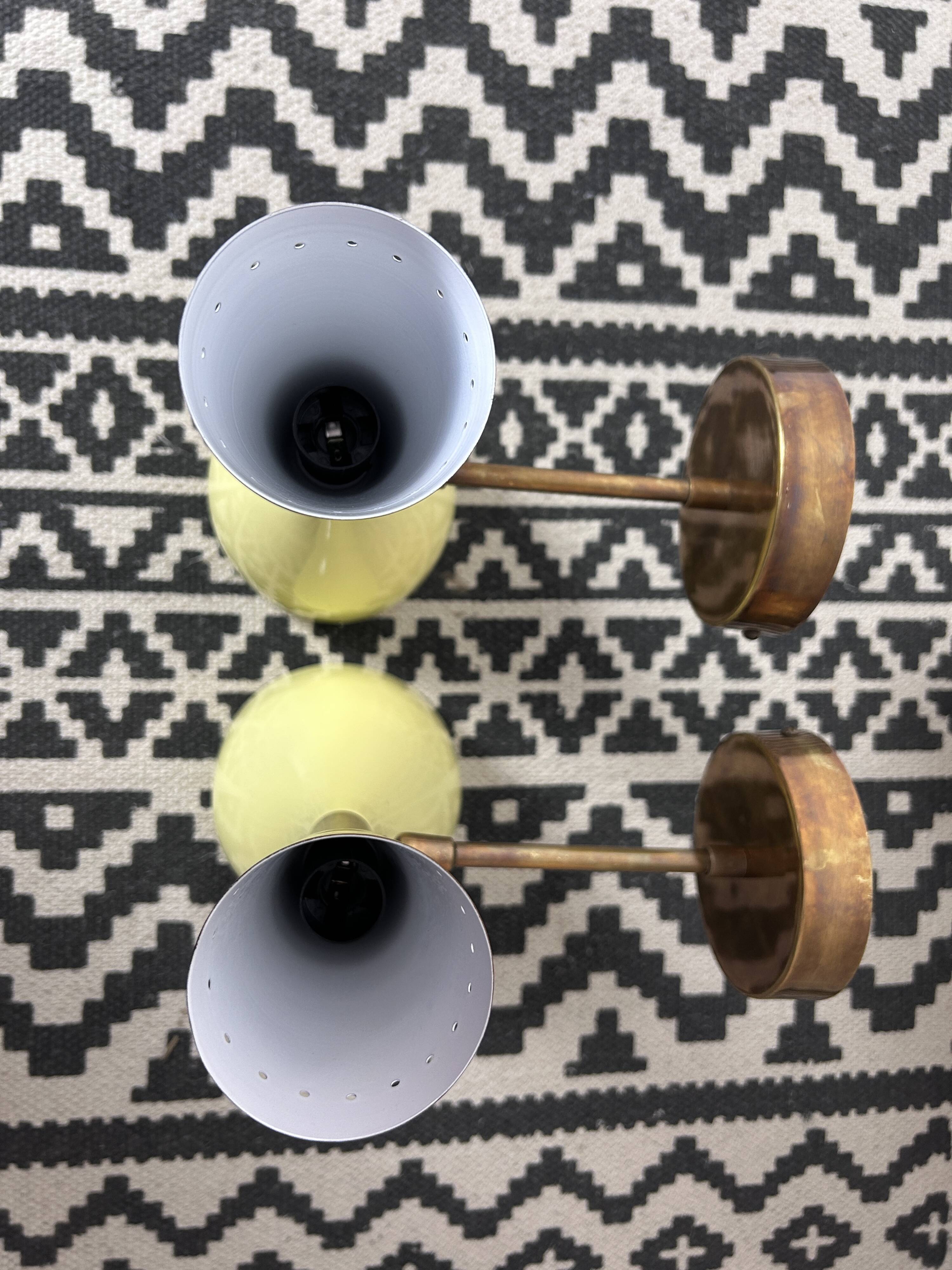 Pair of metal diabolo wall lights