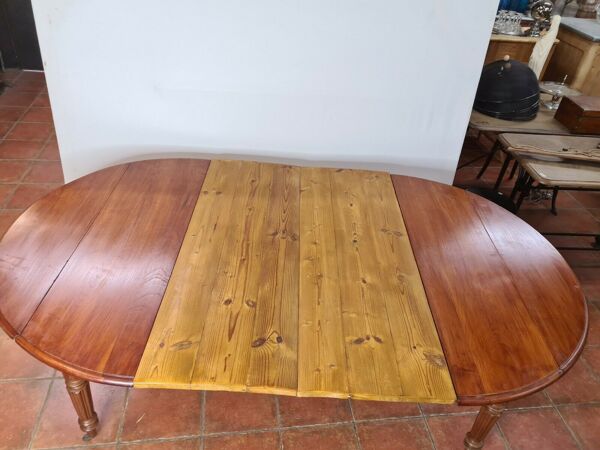 Table ronde 4 pieds en merisier avec 2 allonges
