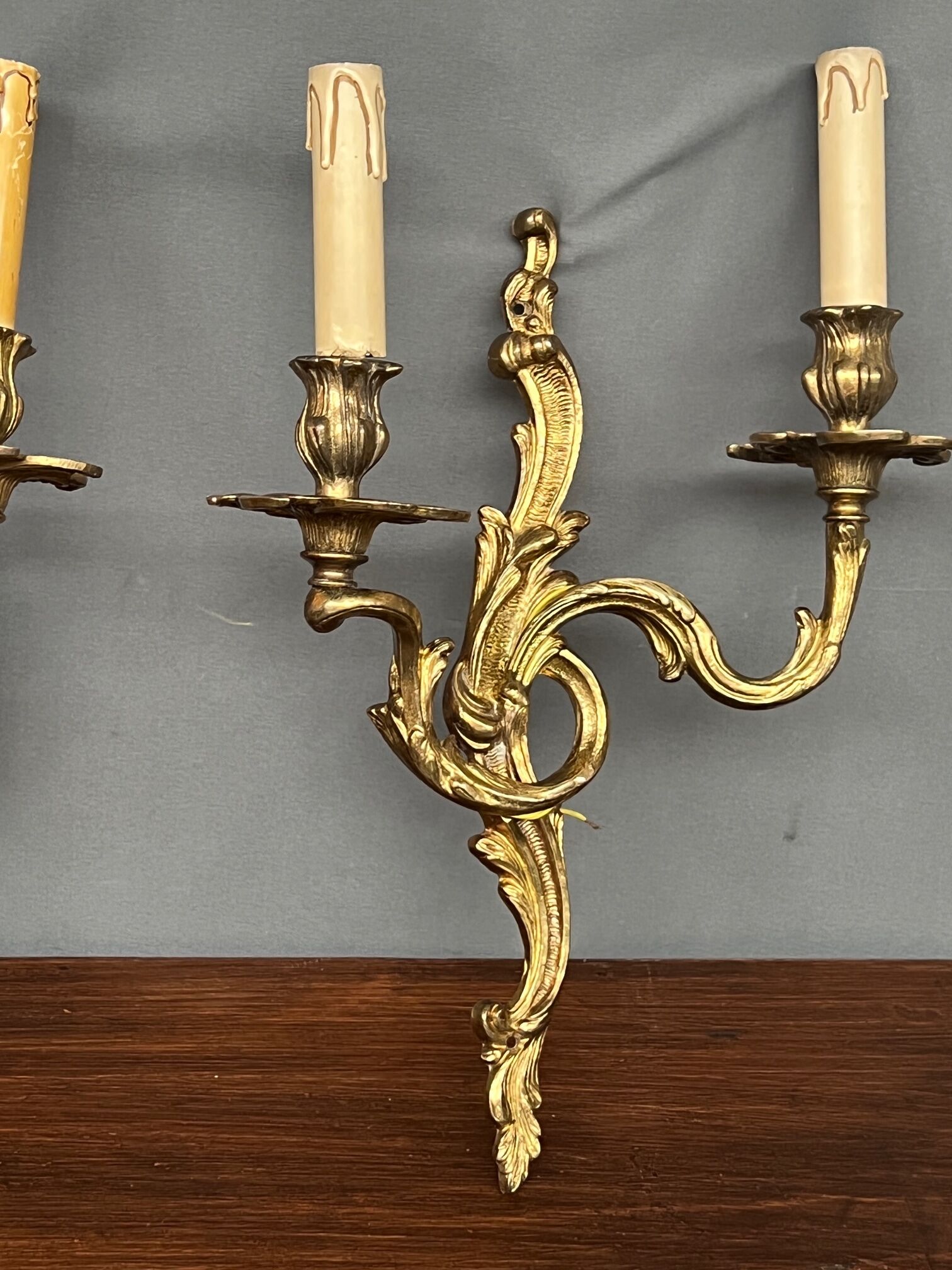 Set of three bronze wall sconces.