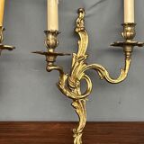 Set of three bronze wall sconces.