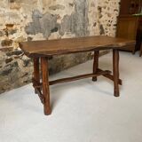 Small rustic table made of solid wood.