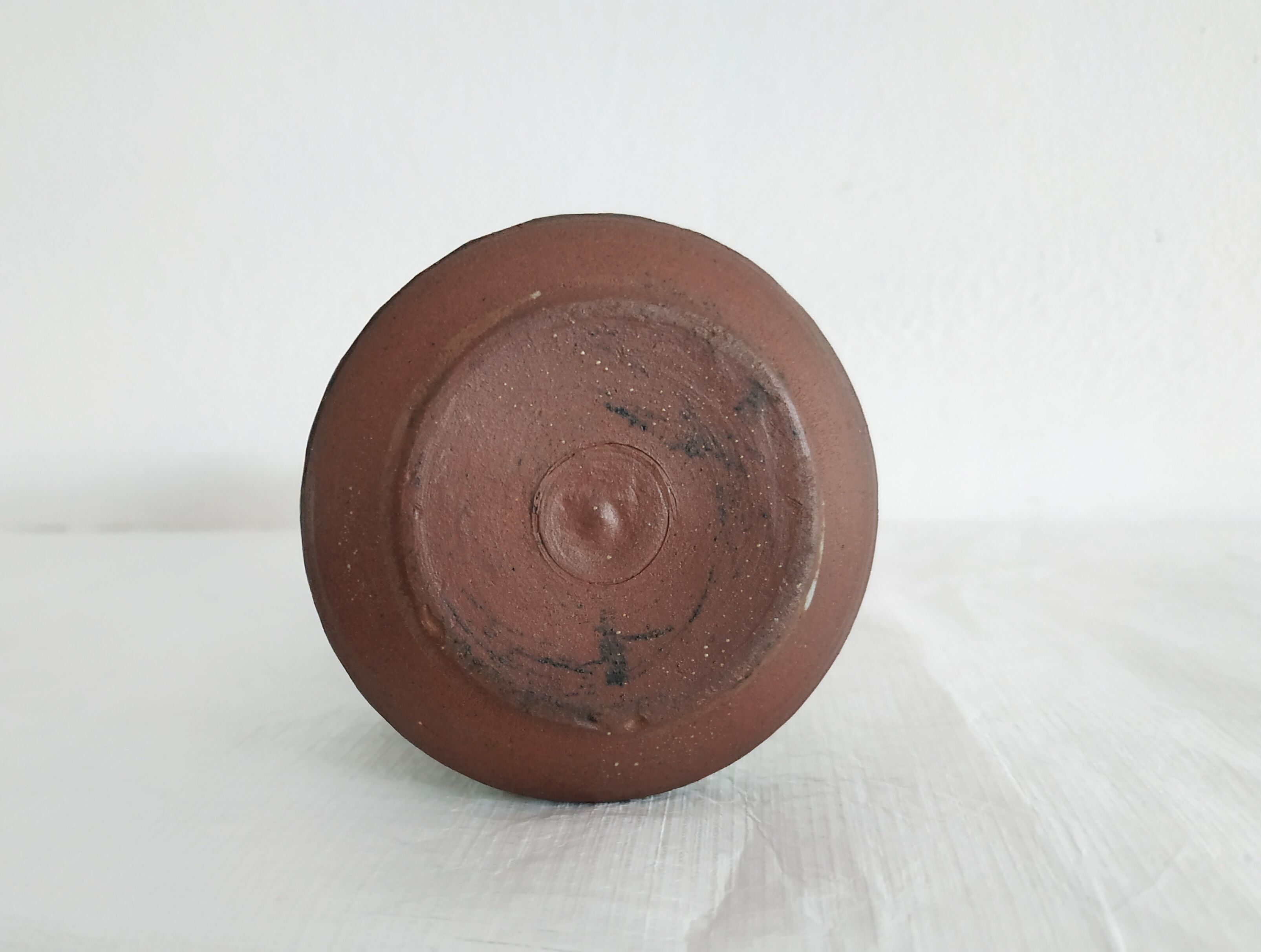 Small brown vintage vase with white enamels