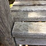 Vintage wooden garden bench with wheels