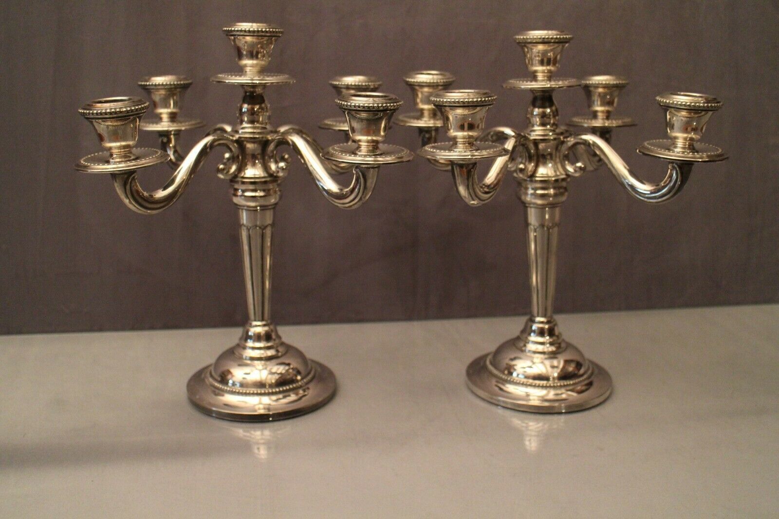 Pair of large candlesticks with 4 silver metal lights in Louis XVI style