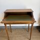 Louis XVI style mahogany telephone table with a green leather top.