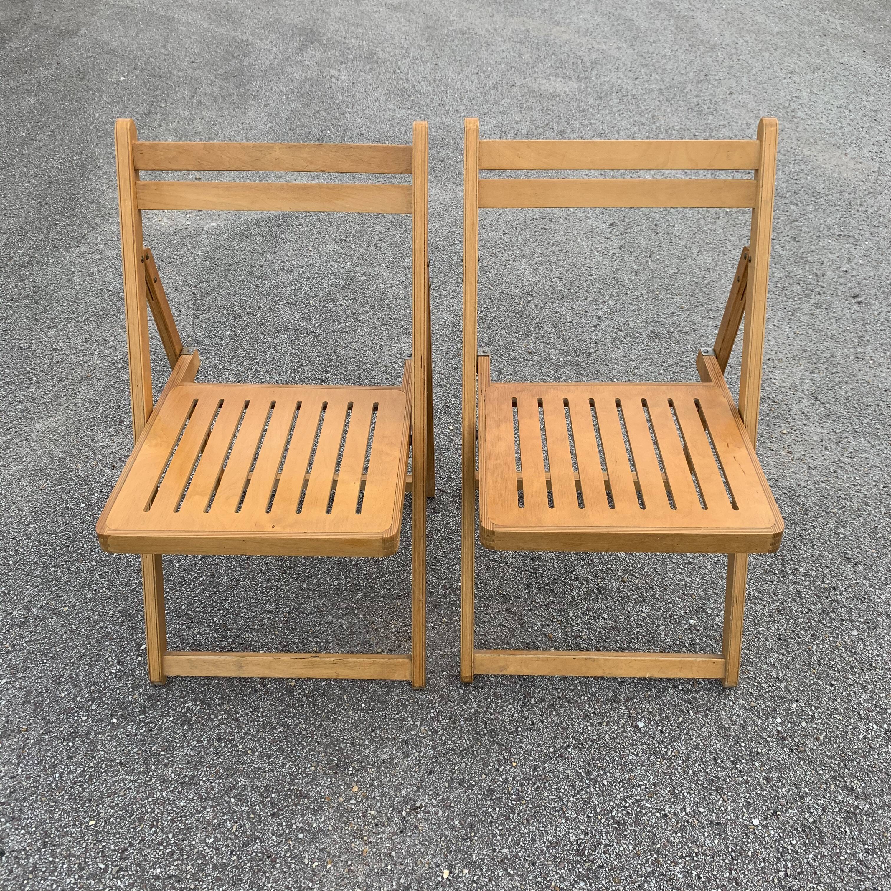 Pair of folding wooden chairs