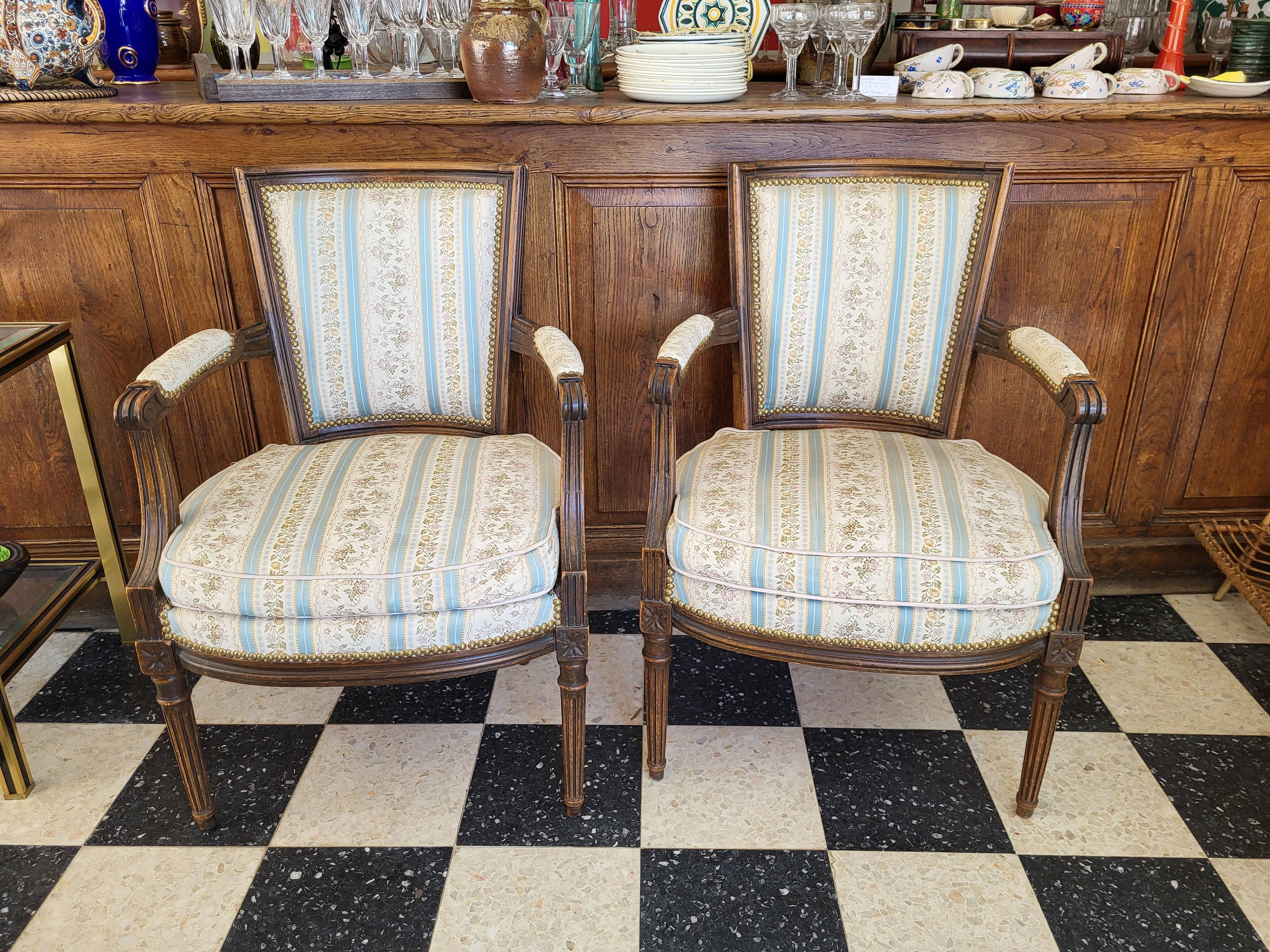 Pair of Louis XVI era convertible armchairs