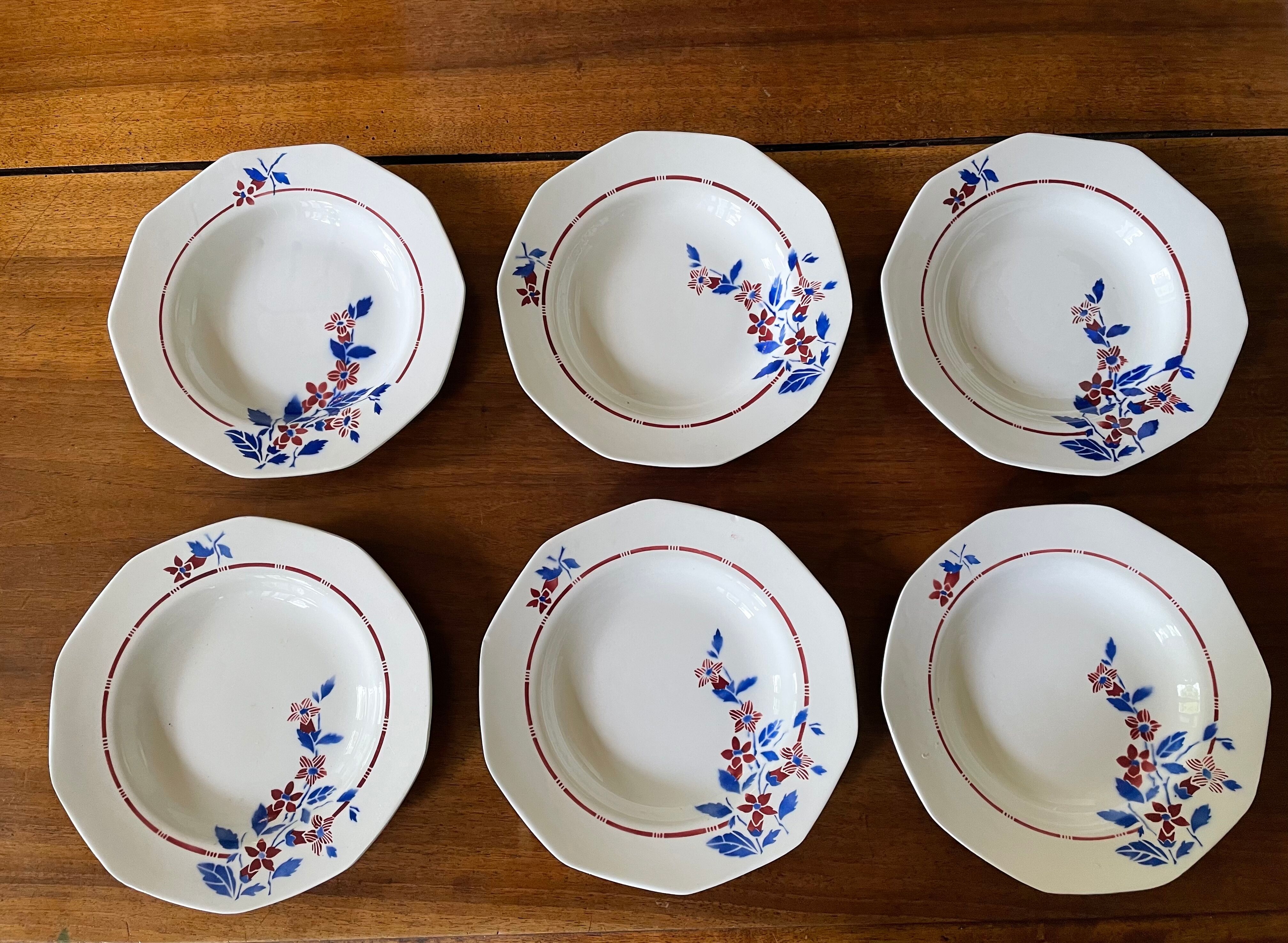 Saint Amand hollow plates decorated with red and blue flowers