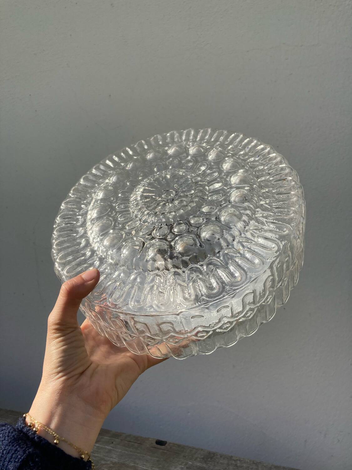 Pair of transparent round glass wall lights