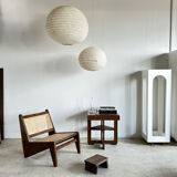 Reclined armchair in canned teak in natural wood