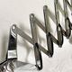 Vintage accordion wall light in chrome metal.