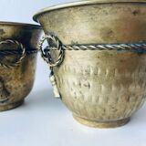 Pair of brass cord pot covers