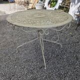 Old garden table in solid wrought iron