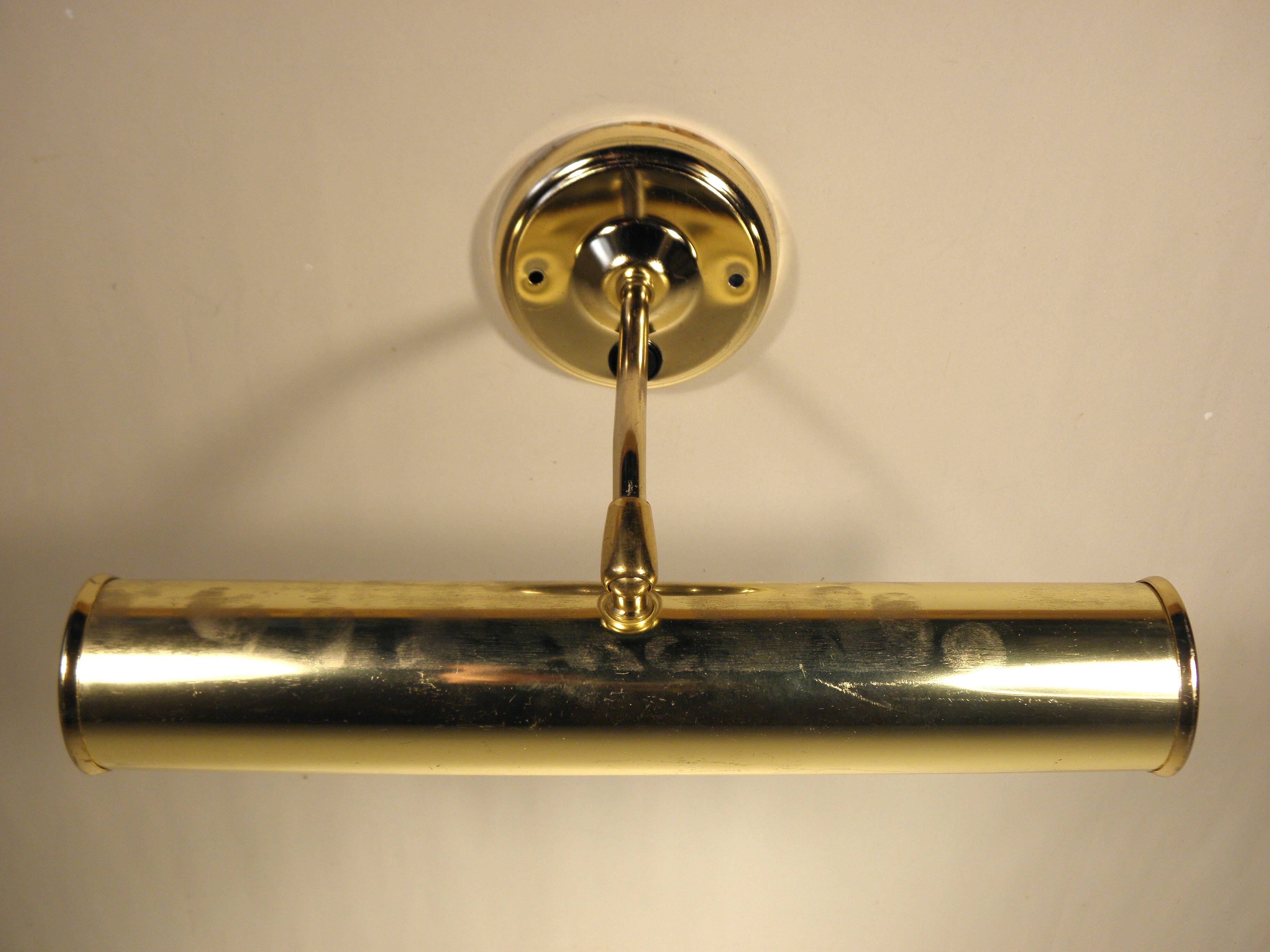 Two gold metal picture sconces