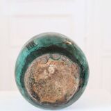 Chinese glazed earthenware vase with bird and flower decoration on a green background