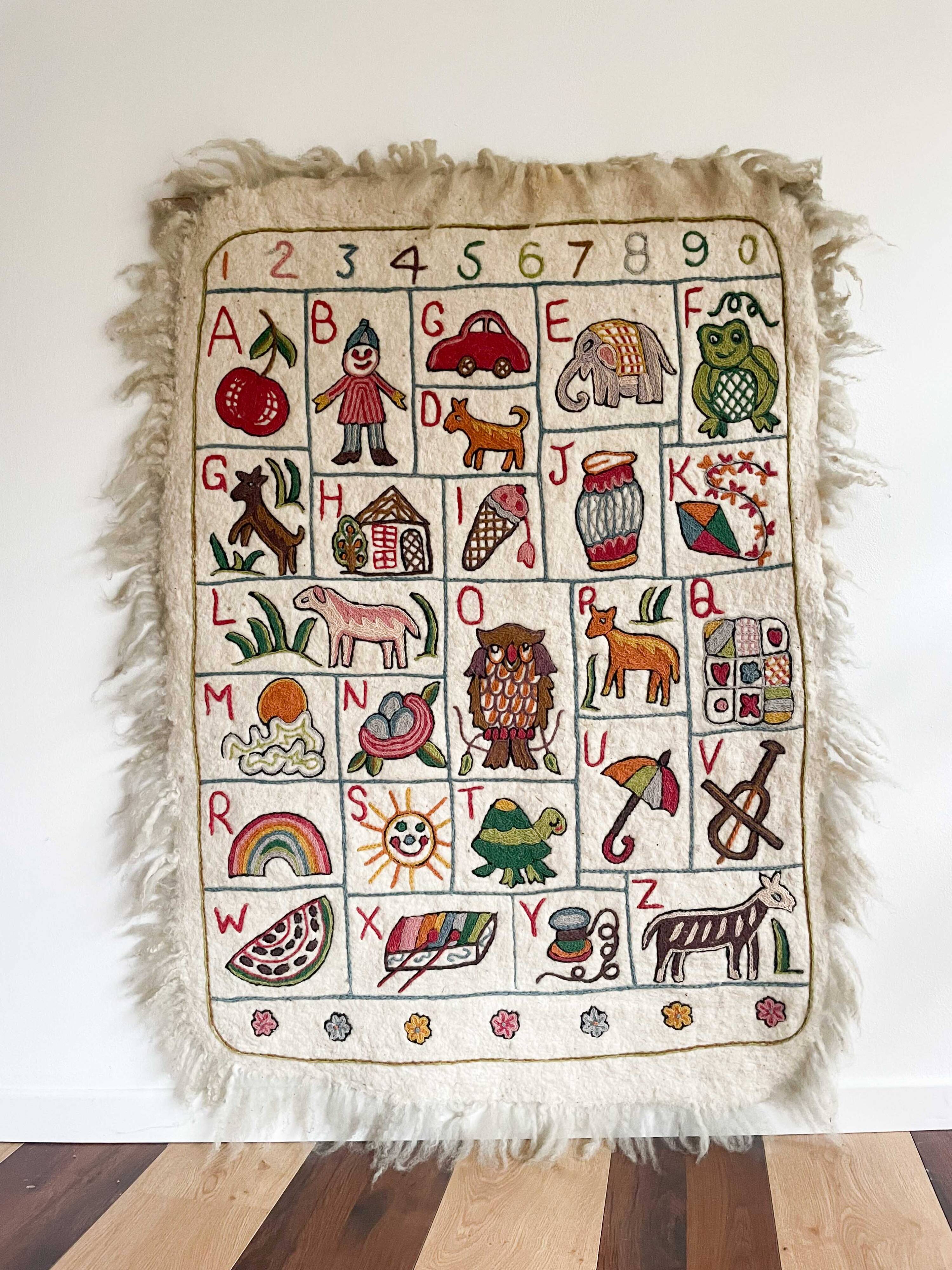 Vintage alphabet wall rug