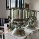 Silver metal champagne bucket.