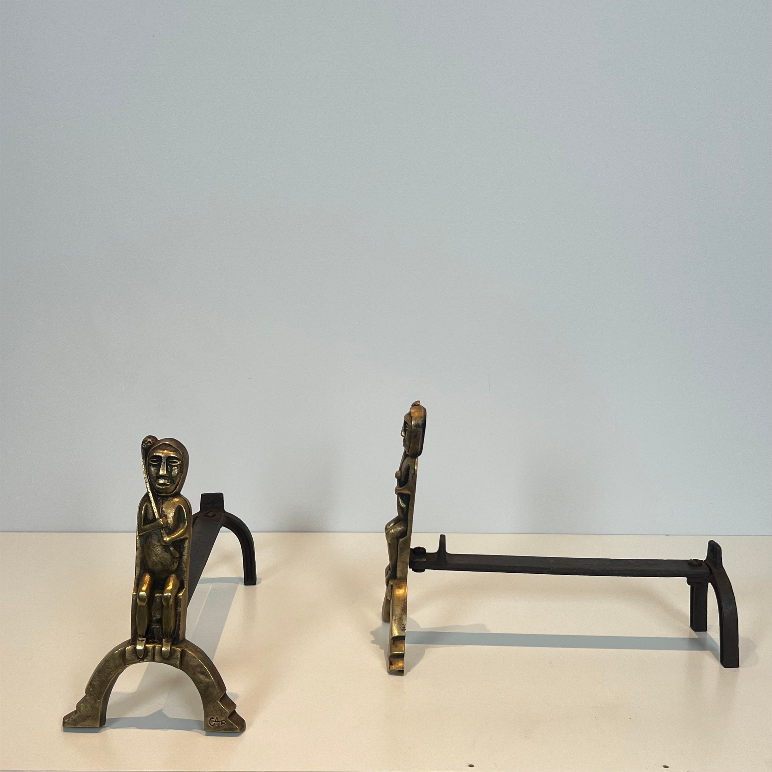 Pair of bronze andirons with seated shamans monogrammed Anton Prinner