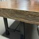 Industrial style table with a mahogany top.