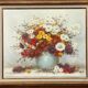 Still life signed with chrysanthemums. Oil on canvas.