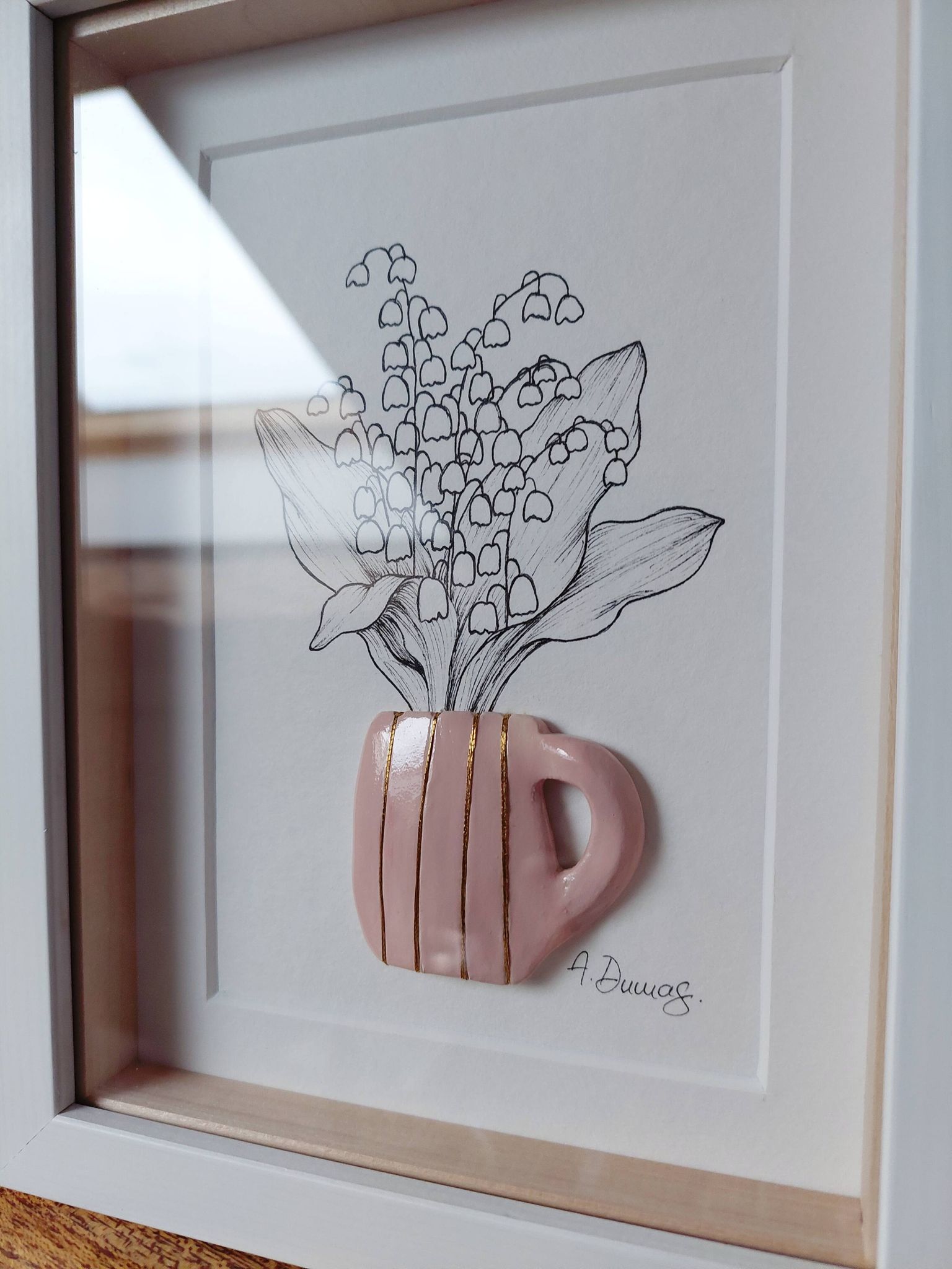 Composition of a bouquet of lily of the valley in a clay mug