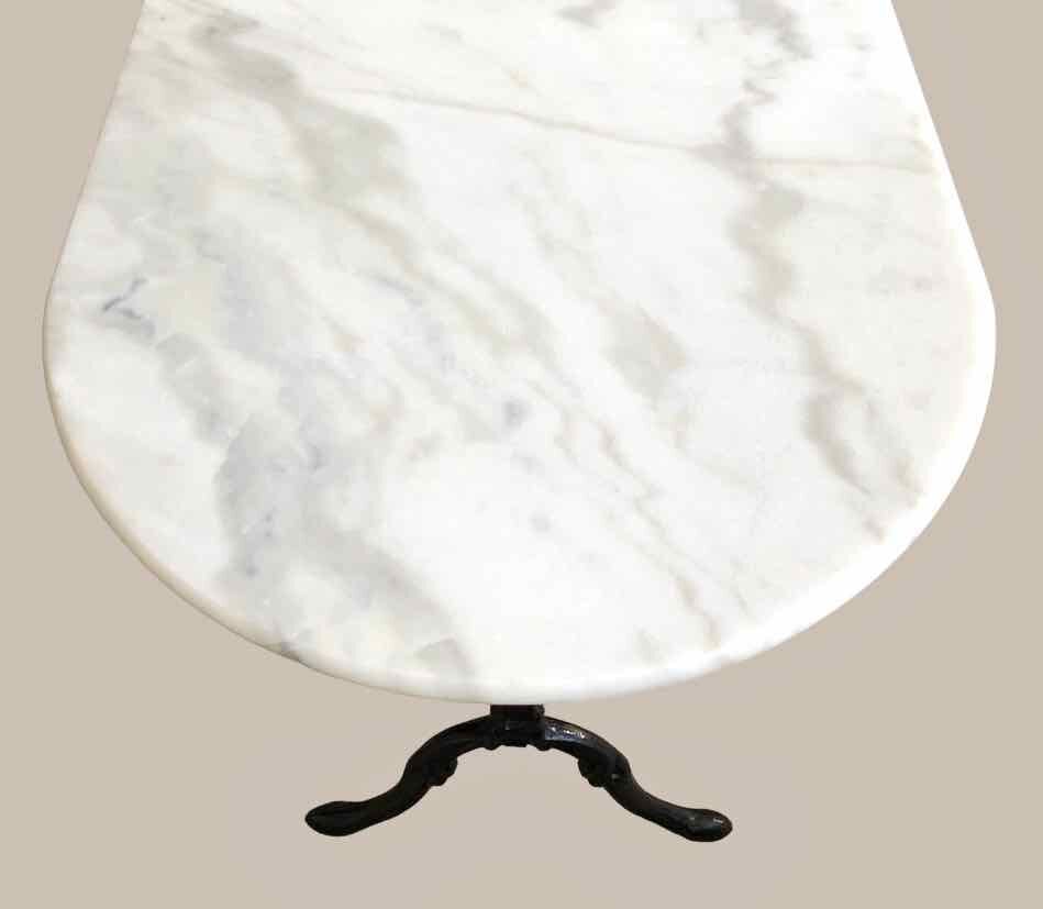Oval marble and cast iron bistro table