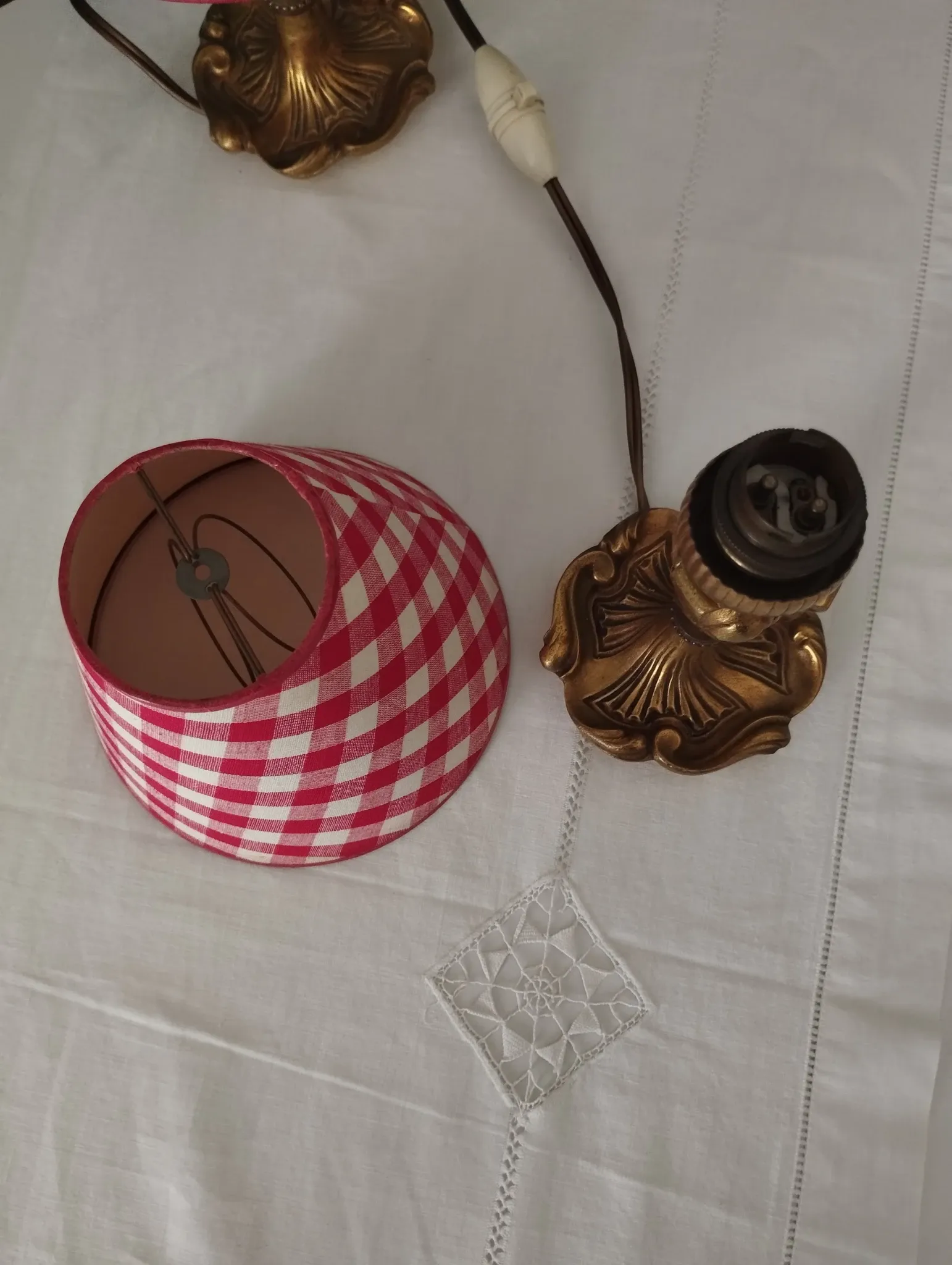 Pair of small lamps in gilded bronze by Petitot and red gingham lampshades.