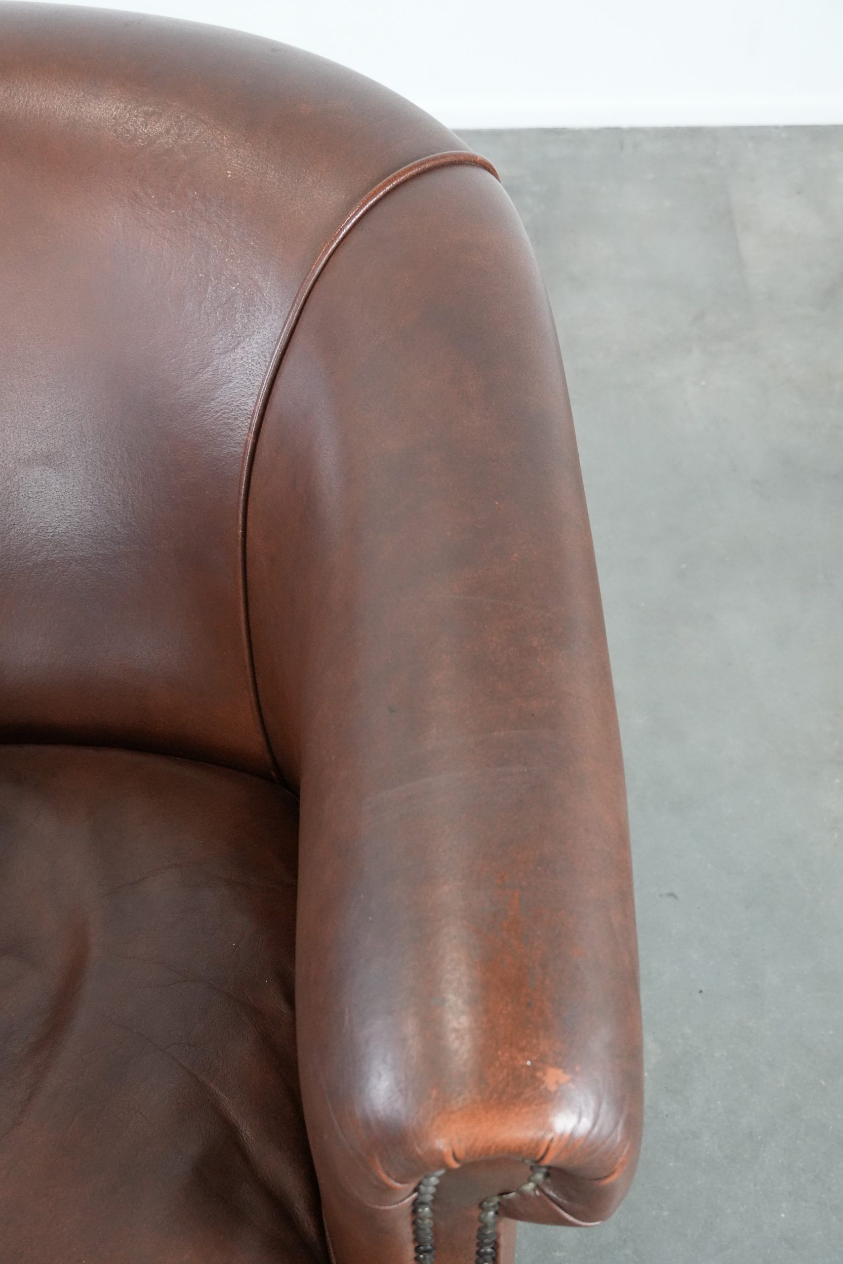 Cognac-coloured cow leather club armchair in English style