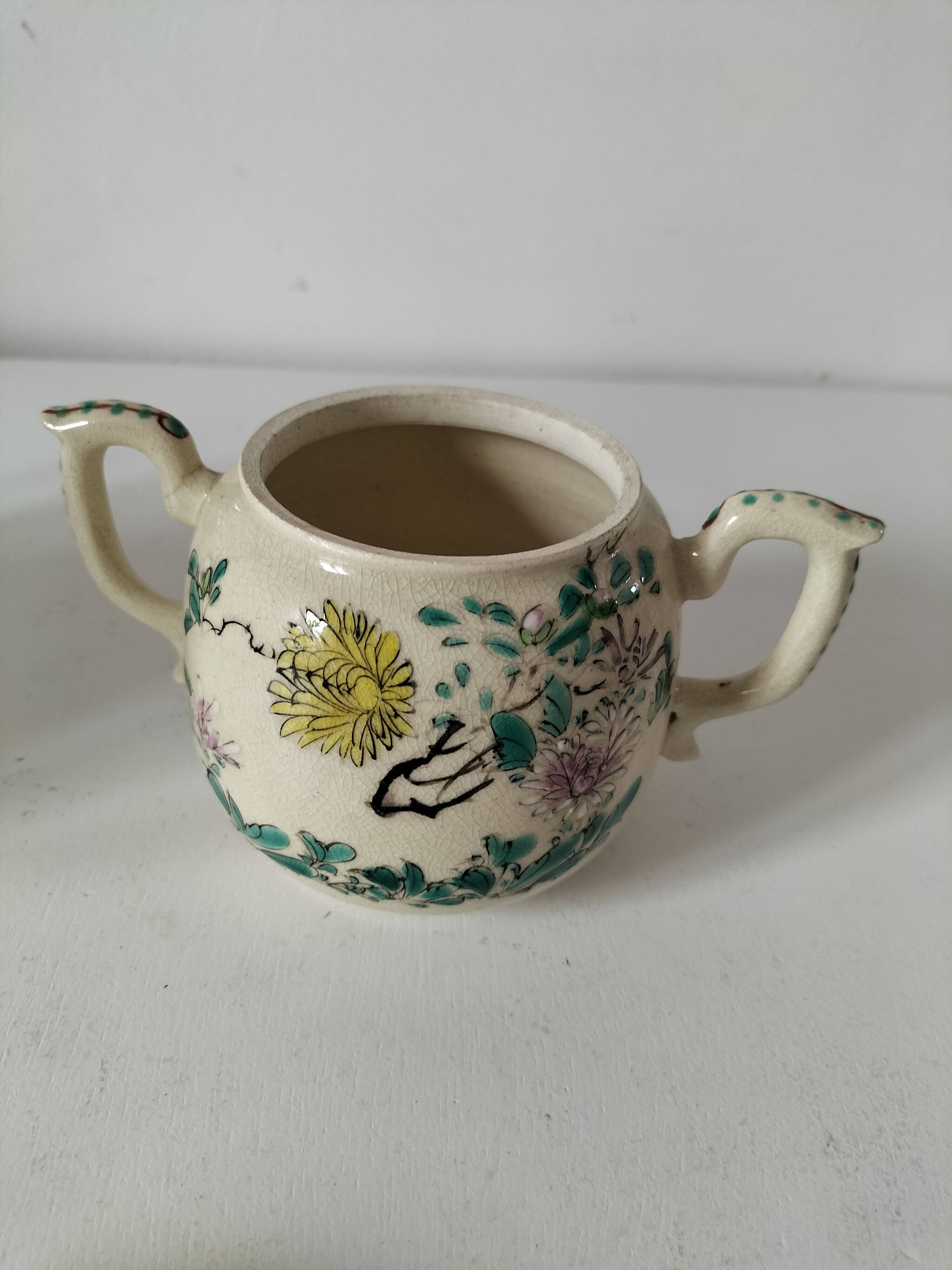 Japanese-style tea set in cracked earthenware with chrysanthemum flowers
