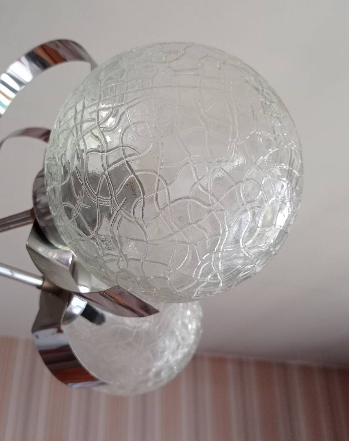 Vintage chandelier with glass globes and chrome steel