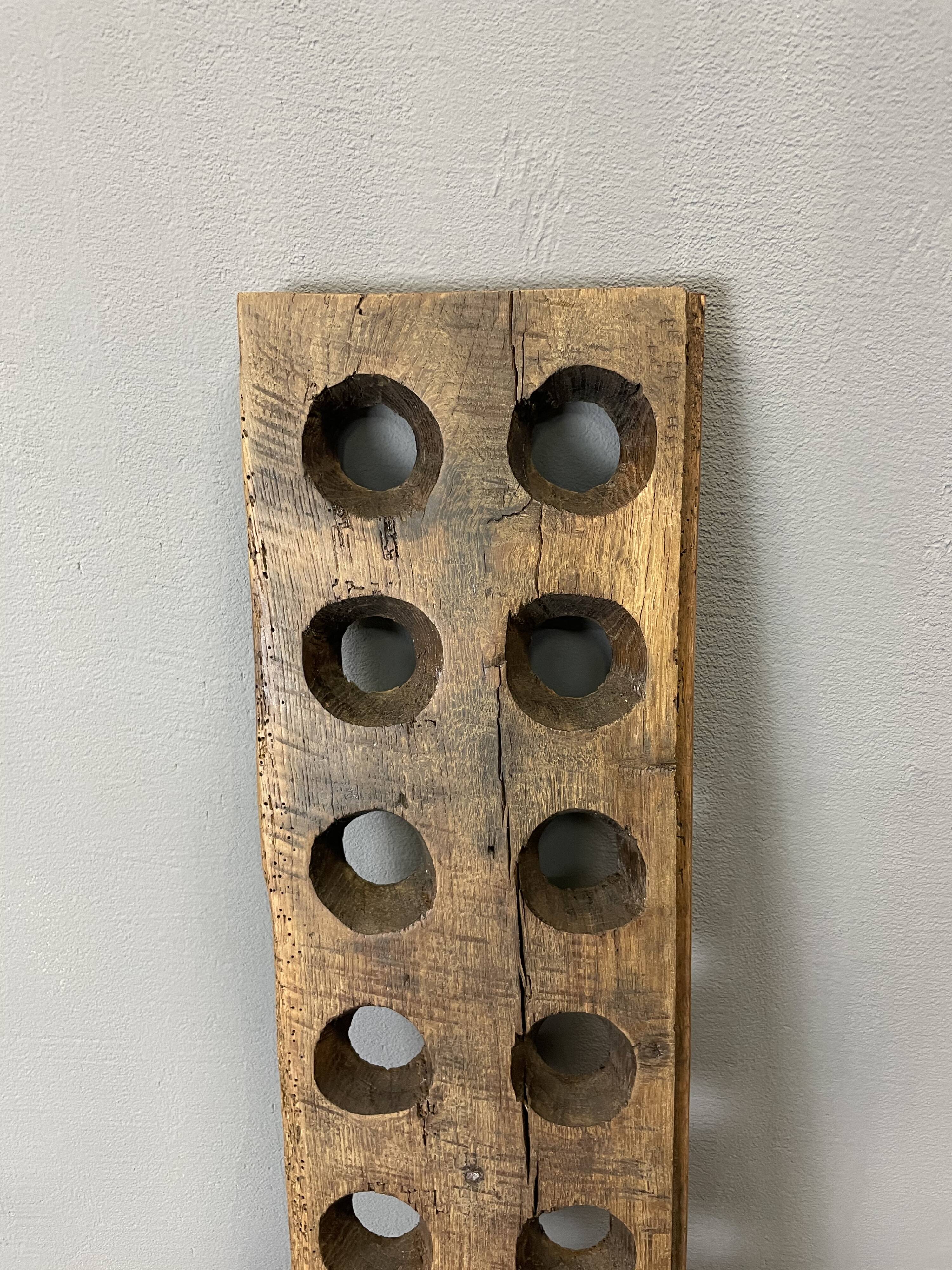 Brutalist oak bottle rack, late nineteenth century