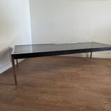 Large designer coffee table from the 70s in chrome, smoked glass, and faux leather.