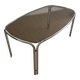 Smoked glass dining table from the 1970s.