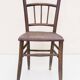 Chair with a slatted backrest and caned seat.