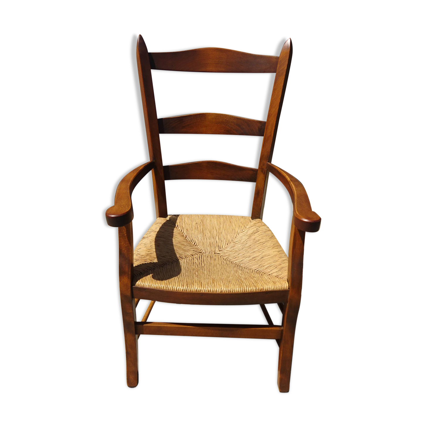 Grandfather's armchair in wood and straw.