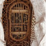 Vintage 1970s wicker cradle on wheels