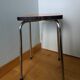 Chrome metal and orange formica stool