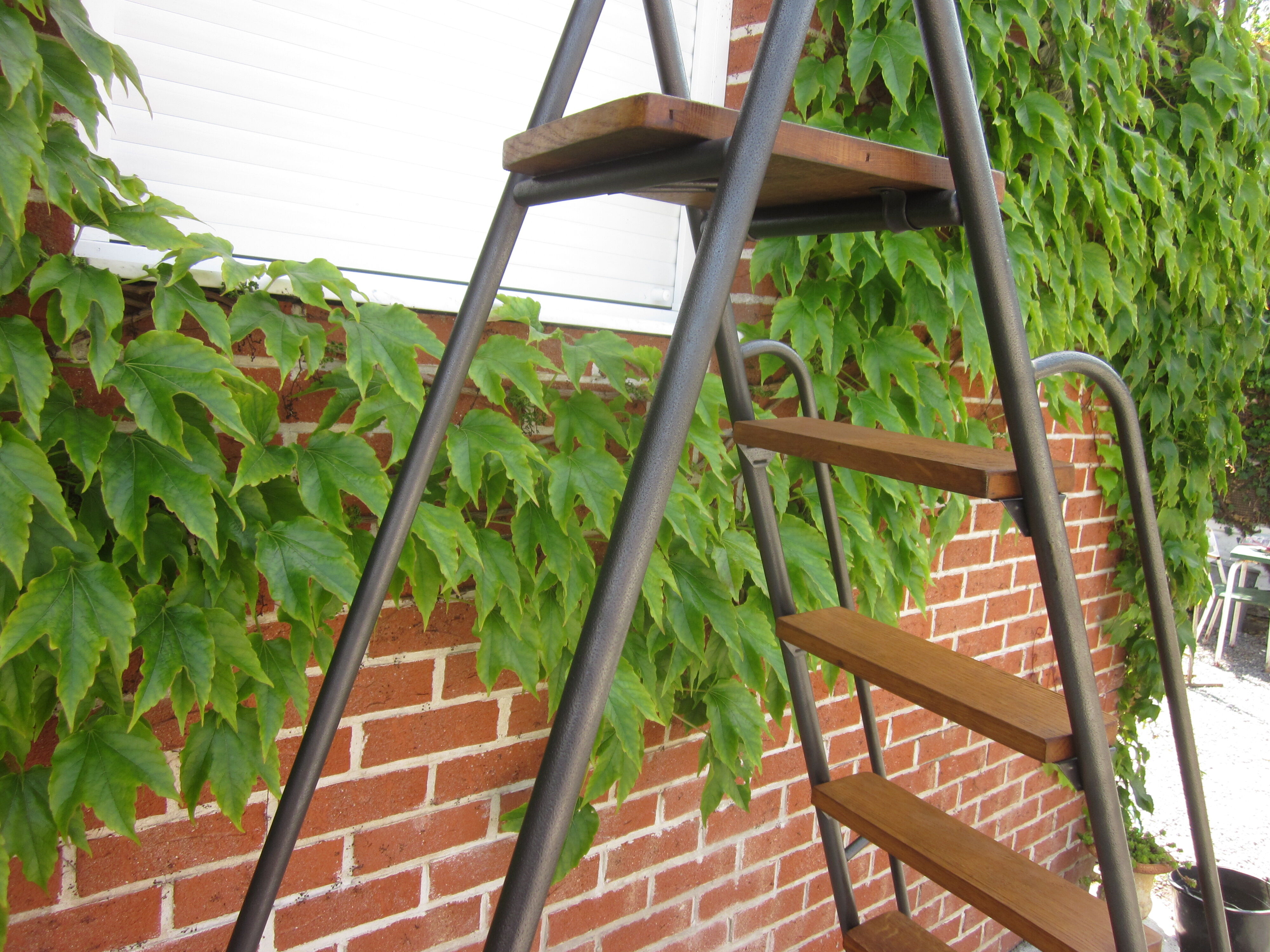 Old stepladder in metal and wood