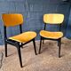 2 vintage chairs in black lacquered wood and yellow/mustard fabric, 1960