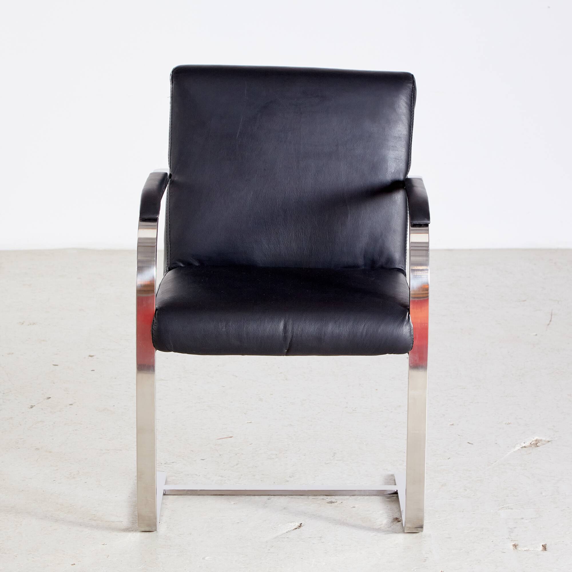 Steel armchair with leather upholstery