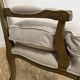 Fauteuil bergère en bois et lin naturel