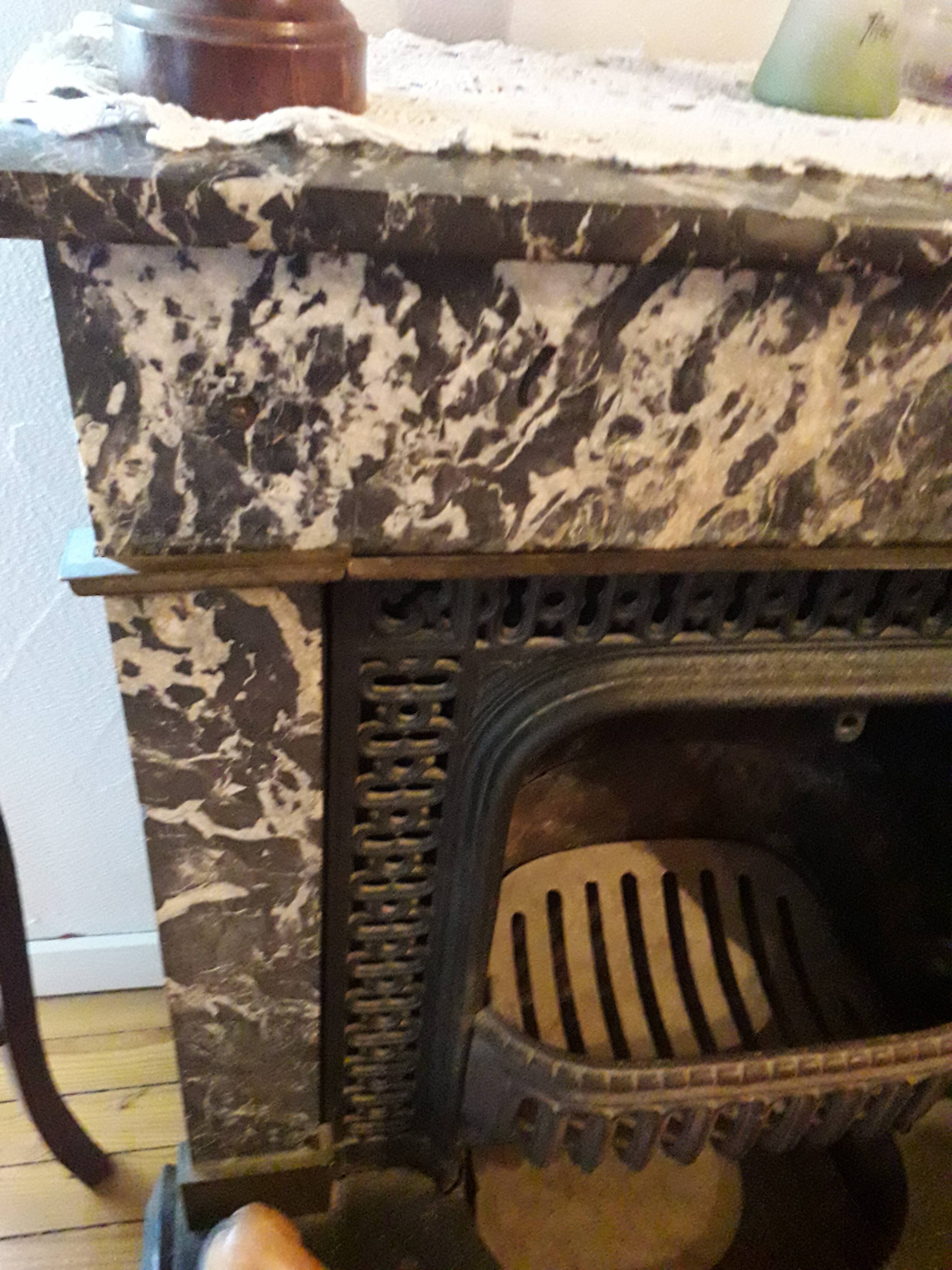 Old black marble fireplace