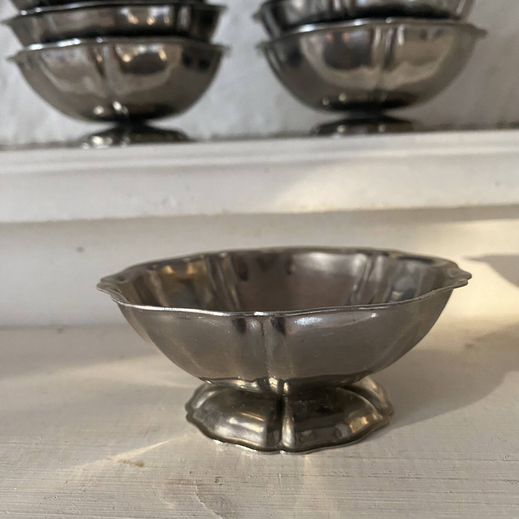 Stainless steel ice cream bowls for one scoop.