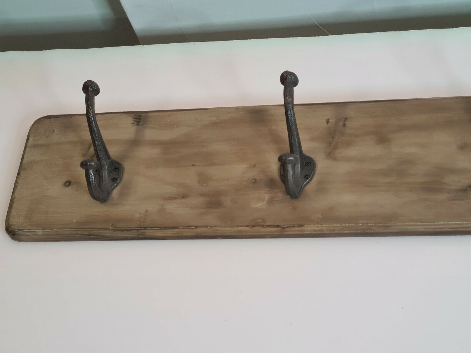 wooden school coat rack and iron hooks
